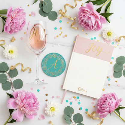 Custom JOY gift set with personalized wine glass coaster and notebook flat lay